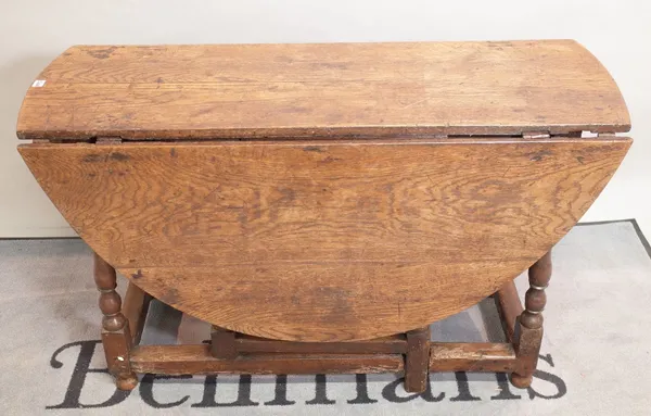 A late 17th century oak drop flap gateleg dining table 124cm wide x 76cm high.