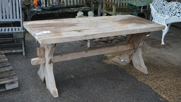 A thick set rectangular pine trestle table, on X-frame supports, 78cm wide x 181cm high.