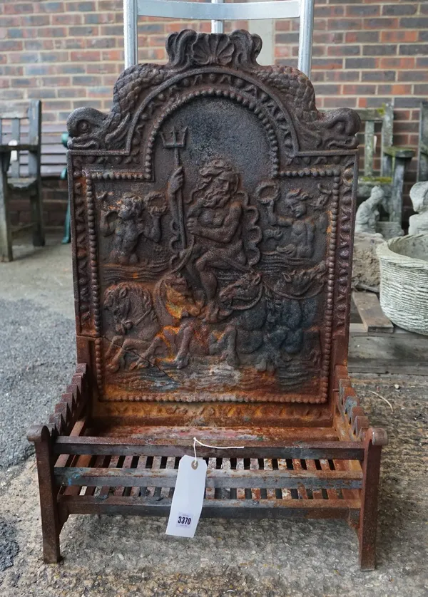 A 19th century cast iron fire back with integral basket, 54cm wide x 87cm high.