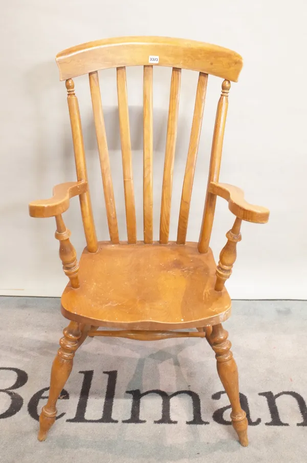 A modern ash and elm stickback open armchair, 56cm wide x 112cm high