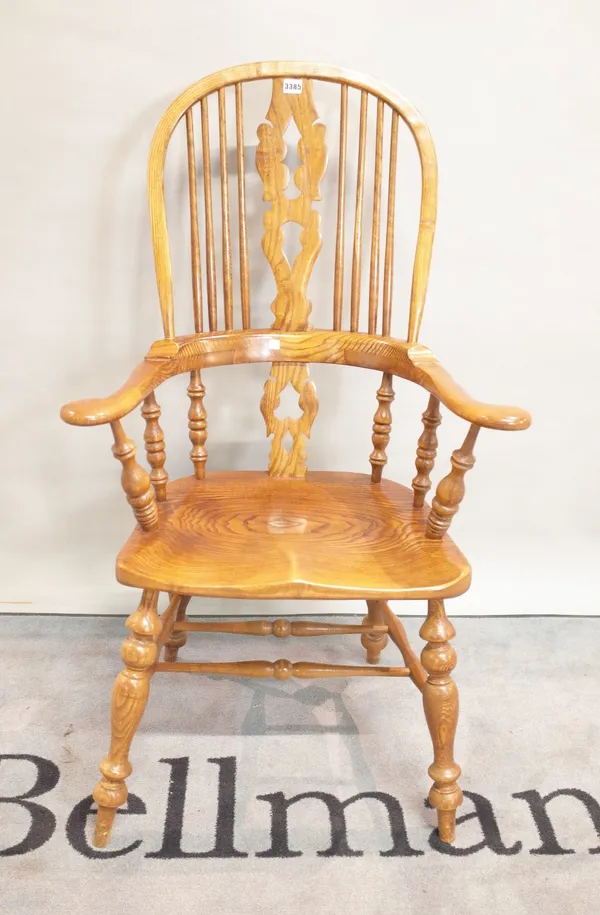 A modern ash and elm windsor open armchair on turned supports, 67cm wide x 114cm high