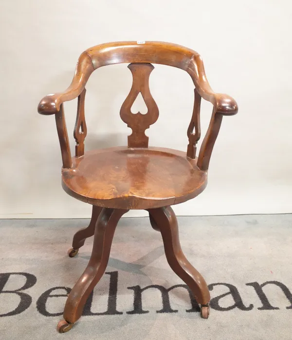 An early 20th century mahogany office swivel chair, 58cm wide x 89cm high.