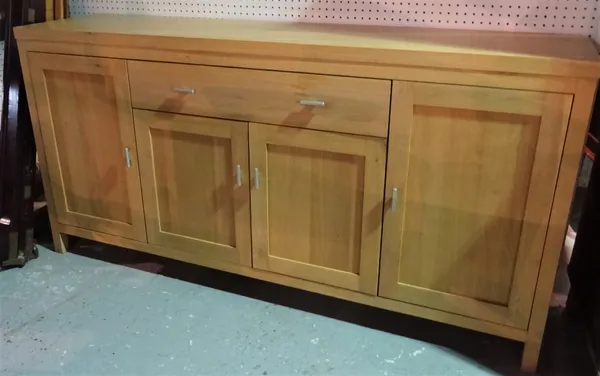 A modern oak sideboard with single central drawer over cupboard doors, 181cm wide x 90cm high