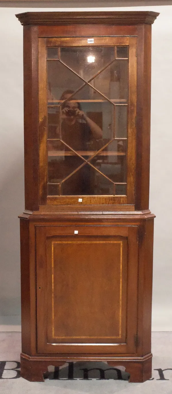 A George III style mahogany floor standing corner display cabinet on bracket feet, 76cm wide x 204cm high.