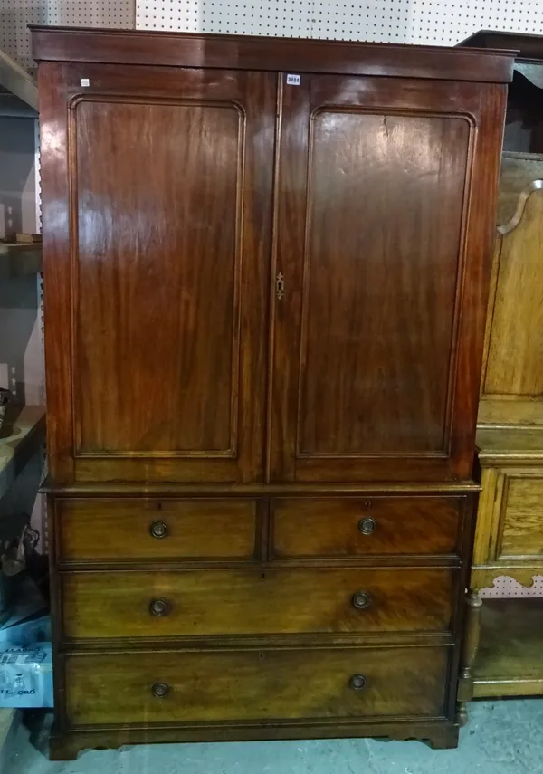 A late George III mahogany linen press with moulded panel doors over two short and two long graduated drawers, 122cm wide x 205cm high.