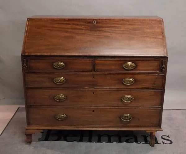 A George III mahogany bureau with two short and three long graduated drawers on bracket feet, 121cm wide x 111cm high.