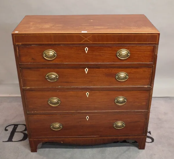 A George III inlaid mahogany chest of four long graduated drawers on bracket feet.