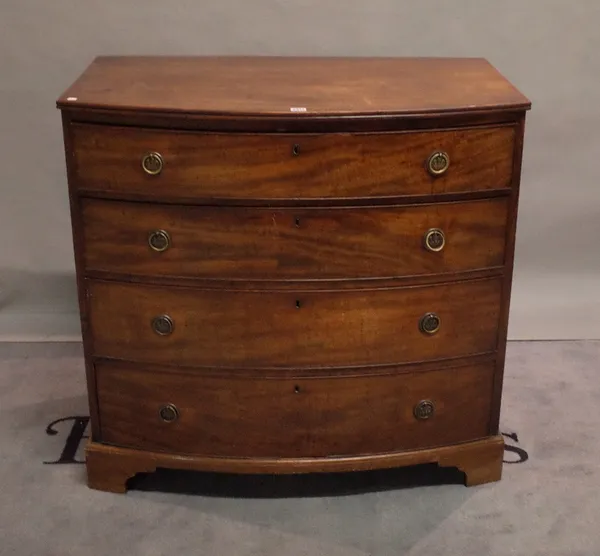 A late George III mahogany bowfront chest of four long graduated drawers on bracket feet, 101cm wide x 97cm high.