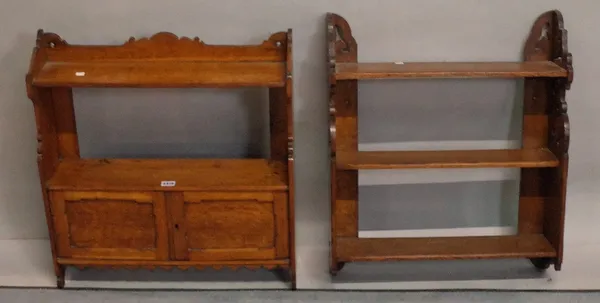 A 19th century oak hanging wall shelf with cupboard base, 58cm wide x 64cm high and a similar three tier hanging shelf, 54cm wide x 64cm high (2).