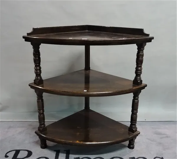 A late Victorian mahogany three tier corner what not, 92cm wide x 100cm high.