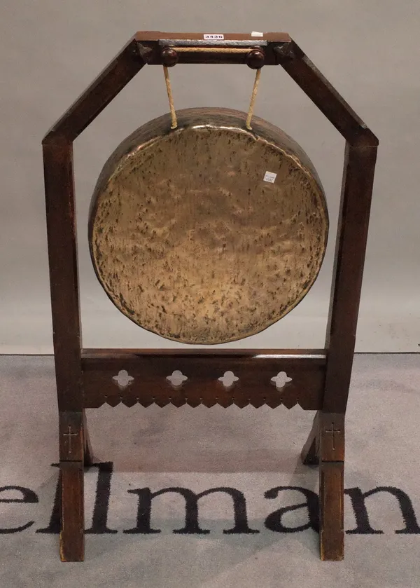 An early 20th century dinner gong, 56cm wide x 96cm high.