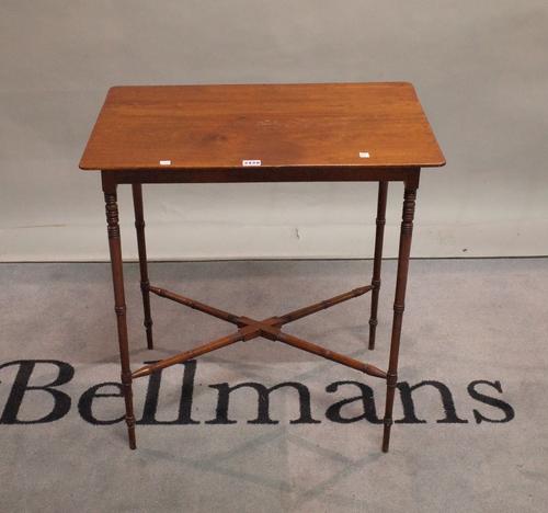 A William IV mahogany occasional table on ring turned supports united by an X frame stretcher, 77cm wide x 68cm high.