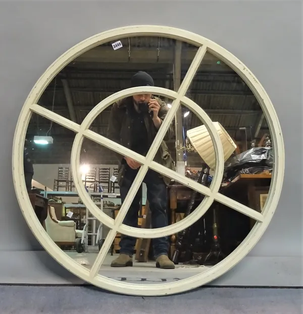 A modern white painted circular marginal wall mirror, 95cm diameter.