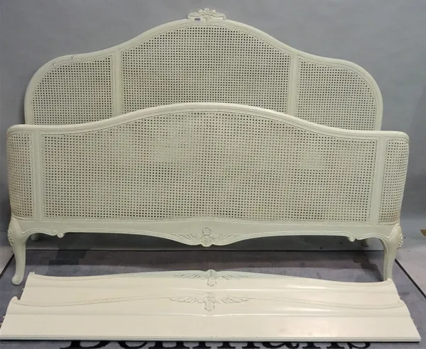 A modern white painted and canework kingsize bed, 185cm wide x 180cm high.