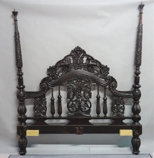 A modern Anglo Indian style barley twist carved four poster bed, 180cm wide (needs setting up).