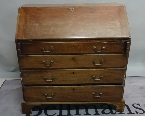 A George III mahogany bureau with four long graduated drawers on bracket feet, 99cm wide x 105cm high.