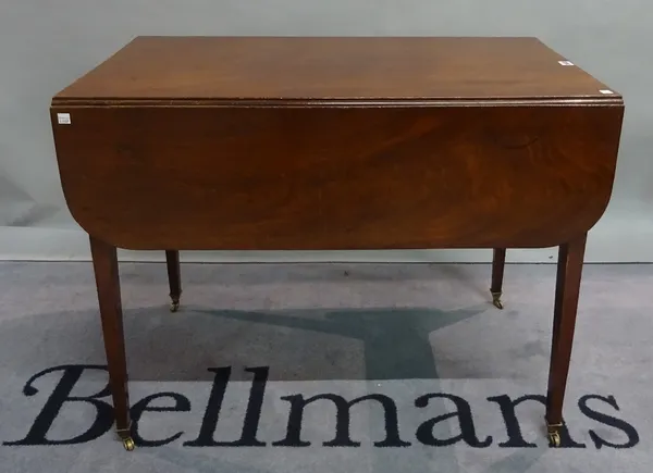 A 19th century mahogany drop flap Pembroke table on tapering, square supports, 91cm wide x 71cm high