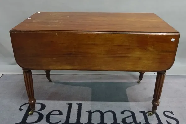 A William IV mahogany drop flap Pembroke table on reeded, tapering supports, 106cm wide x 73cm high