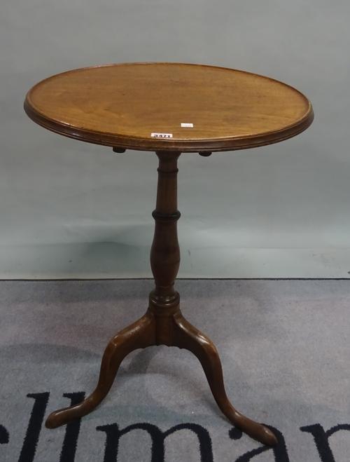 A 19th century mahogany tripod table, the circular dished top on downswept supports, 52cm diamter x 74cm high
