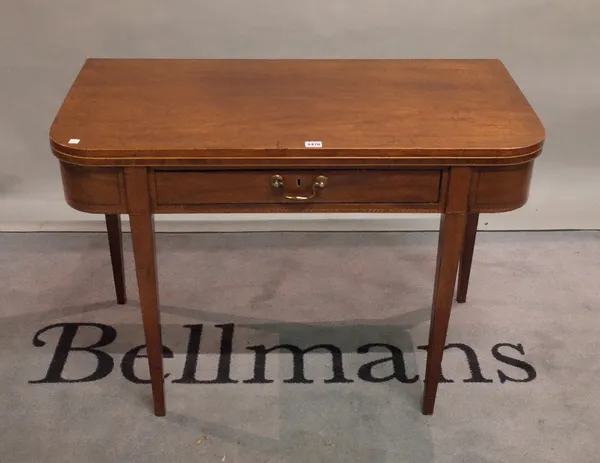 A Regency mahogany fold-over card table, with single freize drawer on tapering square supports, 96cm wide x 71cm high