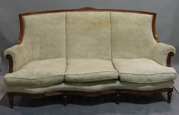 A Louis XVI style stained beech three piece suite comprising a serpentine sofa, 185cm wide x 99cm high and two matching armchairs on fluted tapering s