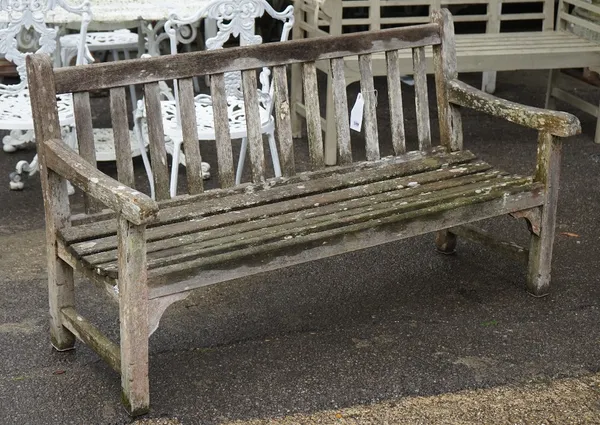 A modern hardwood garden bench 122cm wide x 84cm high.