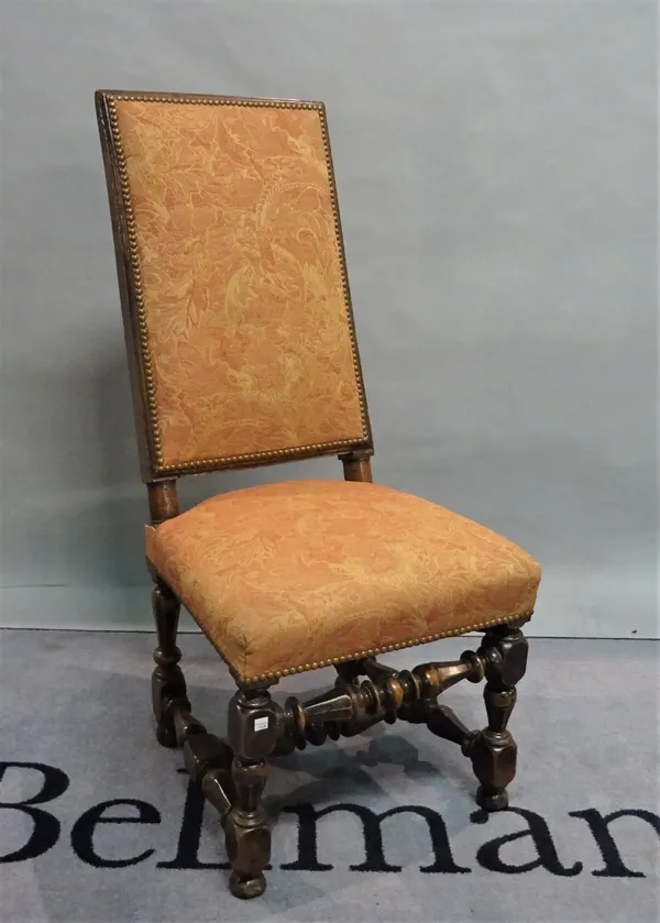 A 19th century continental upholstered side chair on turned supports united by an H frame stretcher, 47cm wide x 105cm high.