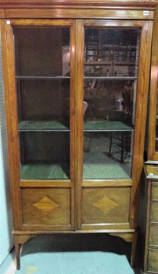 A 19th century mahogany display cabinet on tapering square supports, 95cm wide x 187cm high.