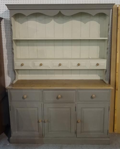 A modern grey painted pine kitchen dresser with a two tier plate rack over a three drawer cupboard base, 147cm wide x 200cm high.