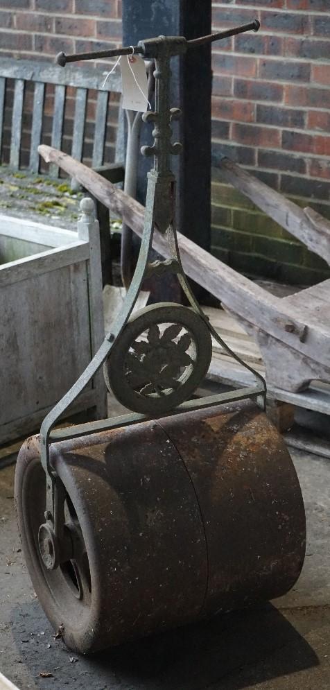 'Hickley &Co. Camberly' and early 20th century cast iron garden roller, 127cm high.