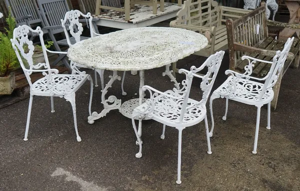 A modern white painted aluminium oval garden table, 135cm wide x 74cm high and four matching open armchairs, 45cm wide x 89cm high (5).