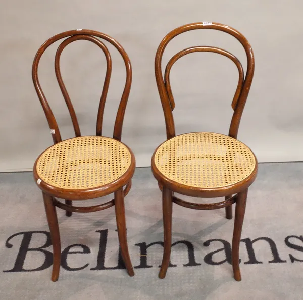 A pair of early 20th century Thonet style bentwood chairs, 92cm tall.