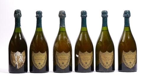 Six bottles of Dom Perignon vintage champagne, five 1966 and one having the label deteriorated.