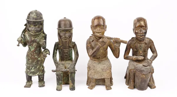 Four African patinated bronze figures, 20th century, two playing musical instruments, 34cm high (4).