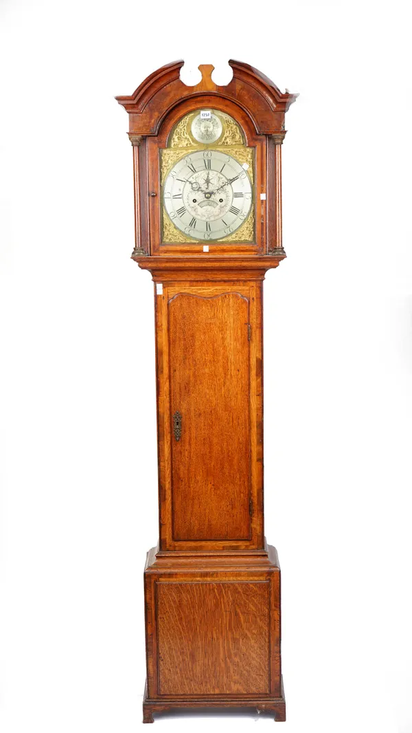 An oak longcase clock, early 19th century, the arch top dial over a brass plate with silvered chapter ring, detailed 'Benjamin Smith, London', over a