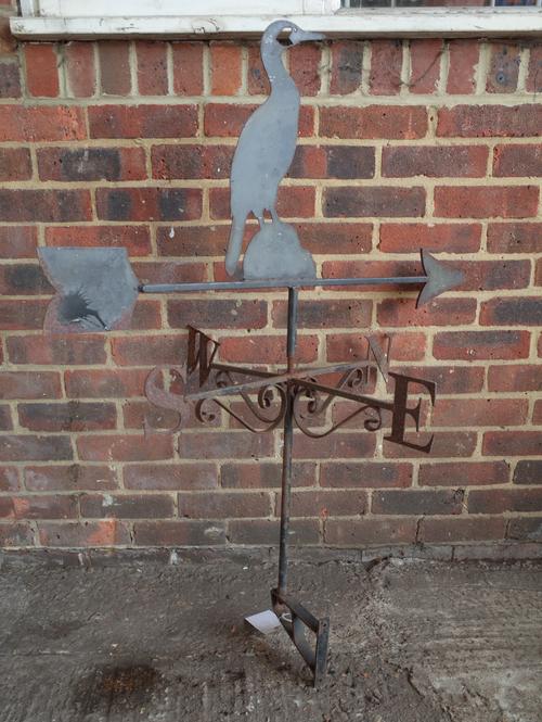 A wrought iron weather vane with cormorant mount, 65cm wide x 118cm high.