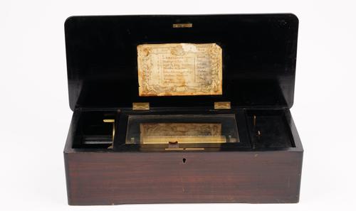 A Swiss rosewood cased cylinder music box, circa 1880, playing 'Eight Airs on a Six', brass roller, 43cm wide x 13cm high x 19cm depth.