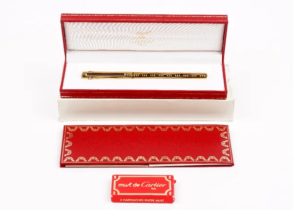 A Must de Cartier gold plated fountain pen, cased, with guarantee card and booklet.