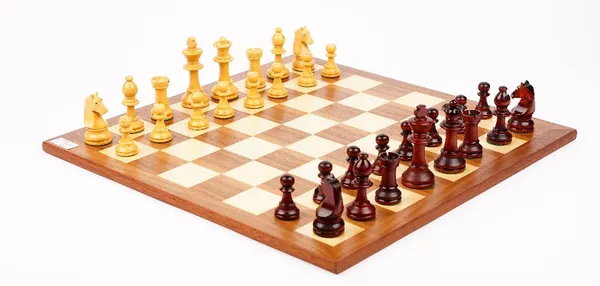 A modern boxwood chess set, cased, and hardwood board, both in Mappin and Webb retailers boxes, the king 9cm high, board 45cm square.