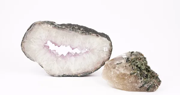 A cross section of a quartz geode, 39cm wide, and a tourmaline bearing quartz mineral sample (2).