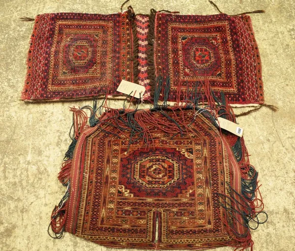 A Tekke Turkman cover, a central gul with minor borders, slit tassels, 53cm x 60cm, and Turkman saddle bag, 100cm x 45cm (2).