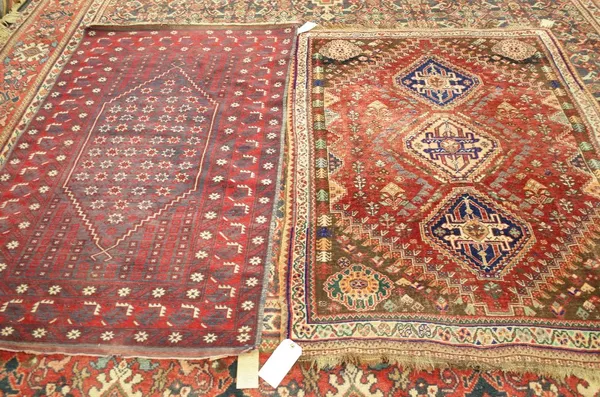 A Ghasgai rug, S.Persian, the madder field with three diamonds, other flower decoration; walnut brown spandrels; an ivory flowerhead and vine border,