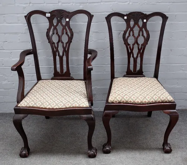 A matched set of twelve George III style mahogany dining chairs on claw and ball feet, to include a pair of carvers (12).