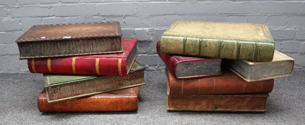 Two 20th century occasional tables, each formed as a stack of leather bound books, both 35cm high, (2).