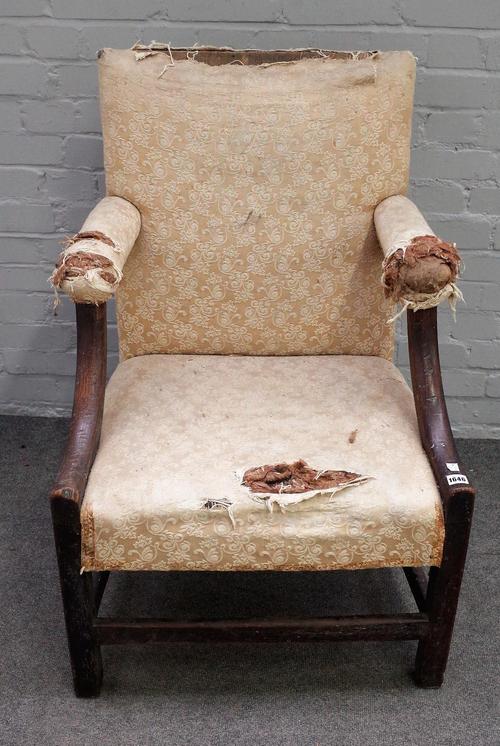 An late 18th/early 19th century Welsh oak framed open armchair on block supports united by stretchers, 65cm wide x 97cm high.