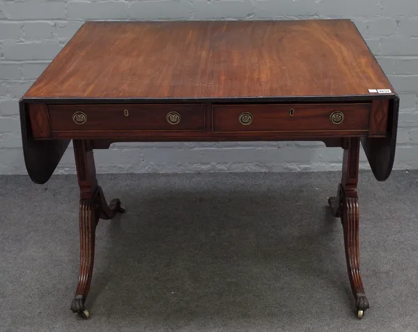 A George III mahogany sofa table, with opposing opposite frieze drawers, on four downswept supports, 92cm wide x 72cm high.