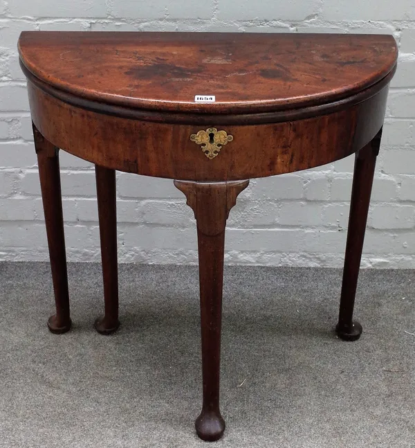 A mid-18th century mahogany semi-elliptic tea table, on pad feet, 74cm wide x 71cm high.