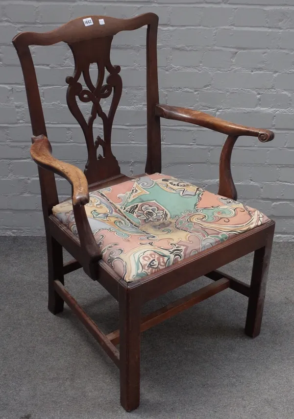 A George III mahogany open arm carver chair with pierced splat on block supports, 75cm wide x 101cm high.