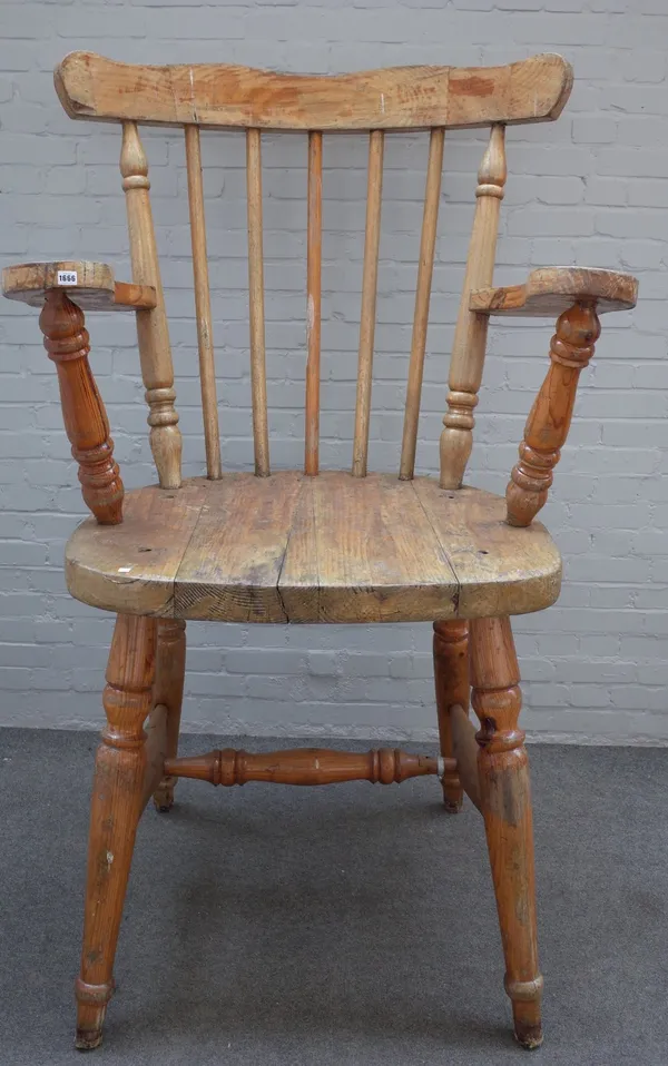 An oversized beech stickback open armchair, on turned supports, 113cm wide x 183cm high, seat height 90cm.