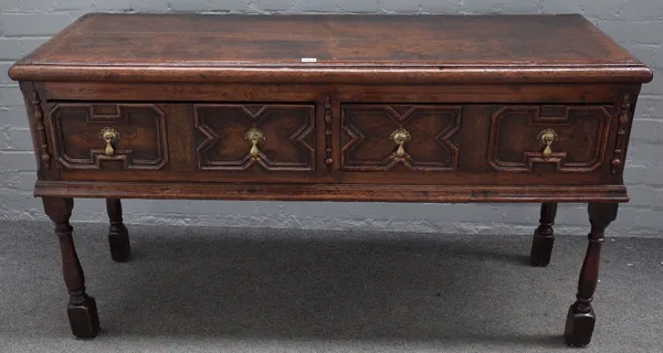 A late 17th century oak low dresser, the moulded rectangular top above two block moulded front frieze drawers between split turnings, on baluster turn